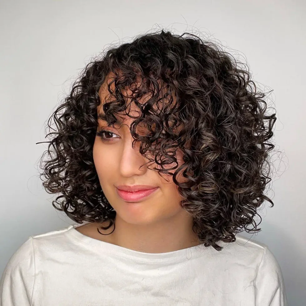shoulder curly chestnut curly bob with curly fringe fringe shown as a medium length haircuts for thick hair idea