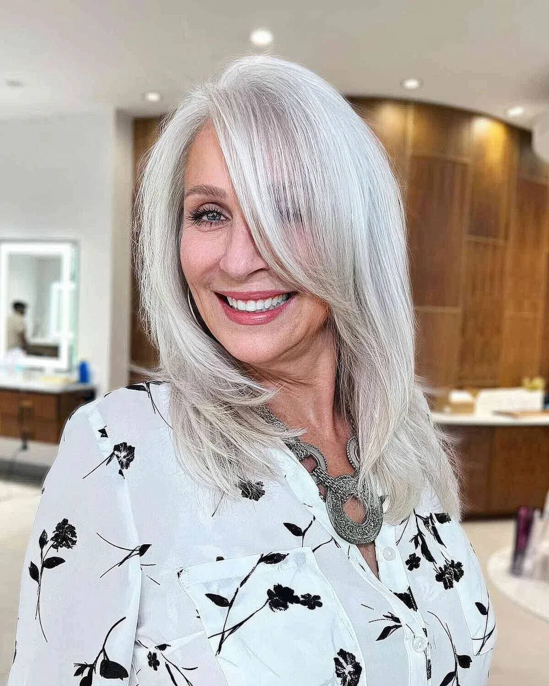 Photo showing naturally silver layered haircut, with the hairstyle clearly visible.
