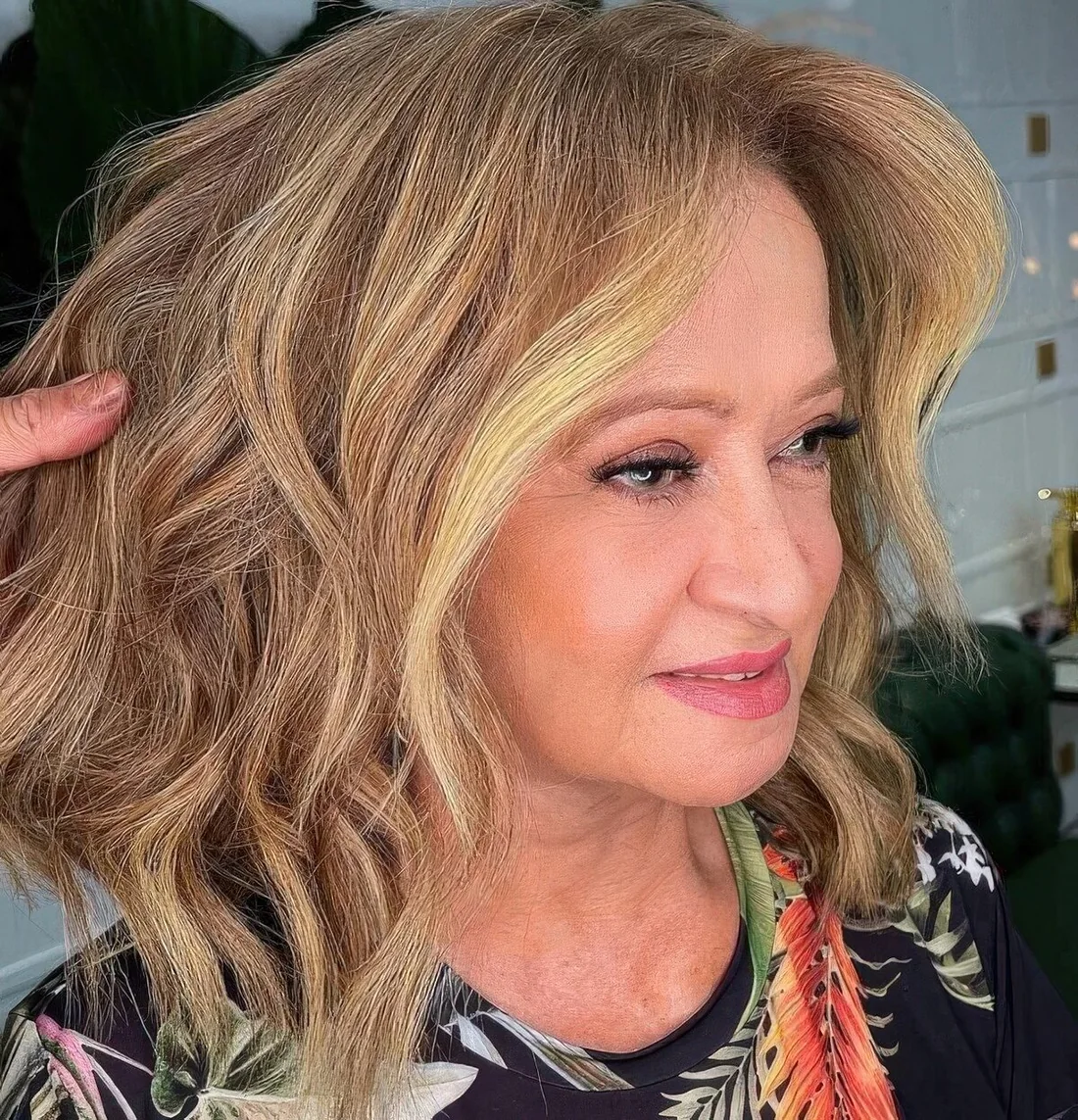 Photo showing mid length choppy haircut, with the hairstyle clearly visible.