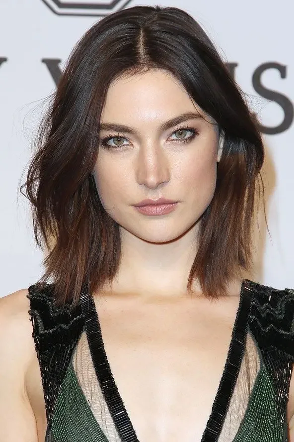Photo showing lob long curtain bangs, with the hairstyle clearly visible.