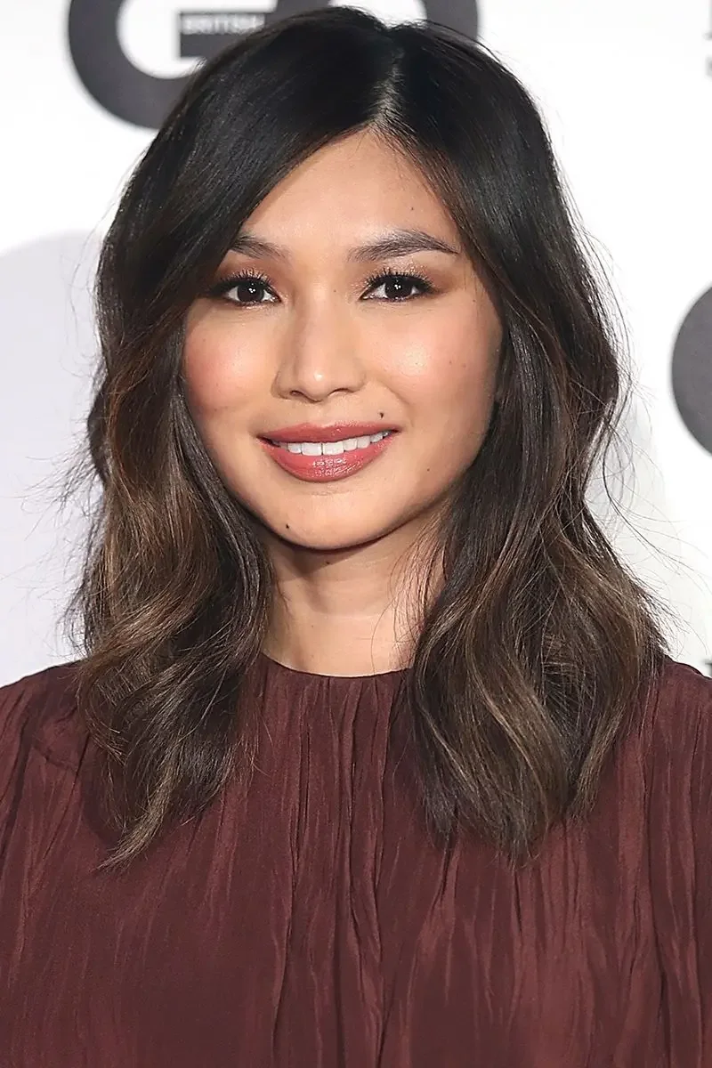 Photo showing layered cut caramel accents, with the hairstyle clearly visible.