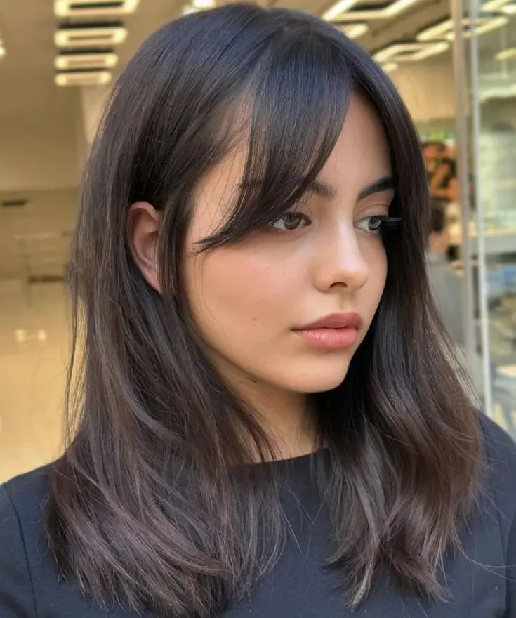 Photo showing lob with bangs, with the hairstyle clearly visible.
