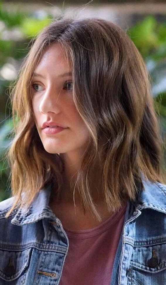 Photo showing wavy long bob, with the hairstyle clearly visible.