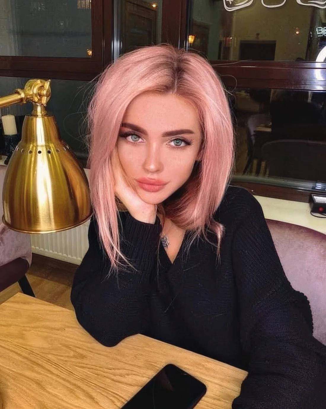 Photo showing pastel pink long bob, with the hairstyle clearly visible.