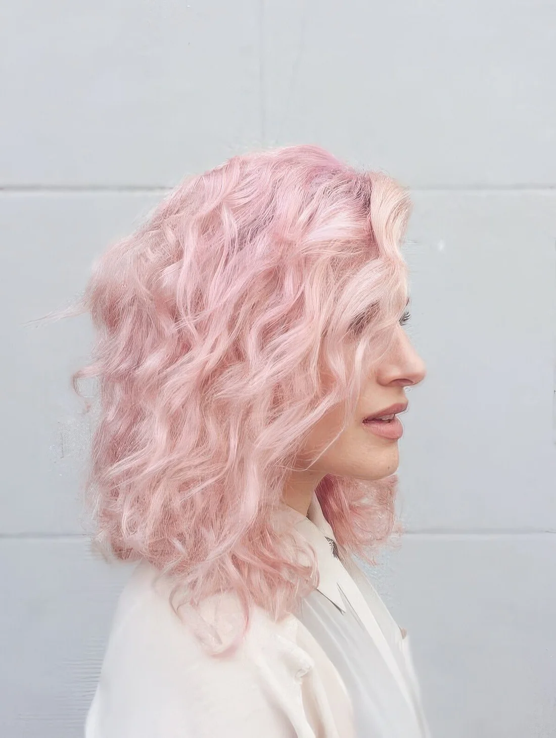 Photo showing very light shade of pink, with the hairstyle clearly visible.