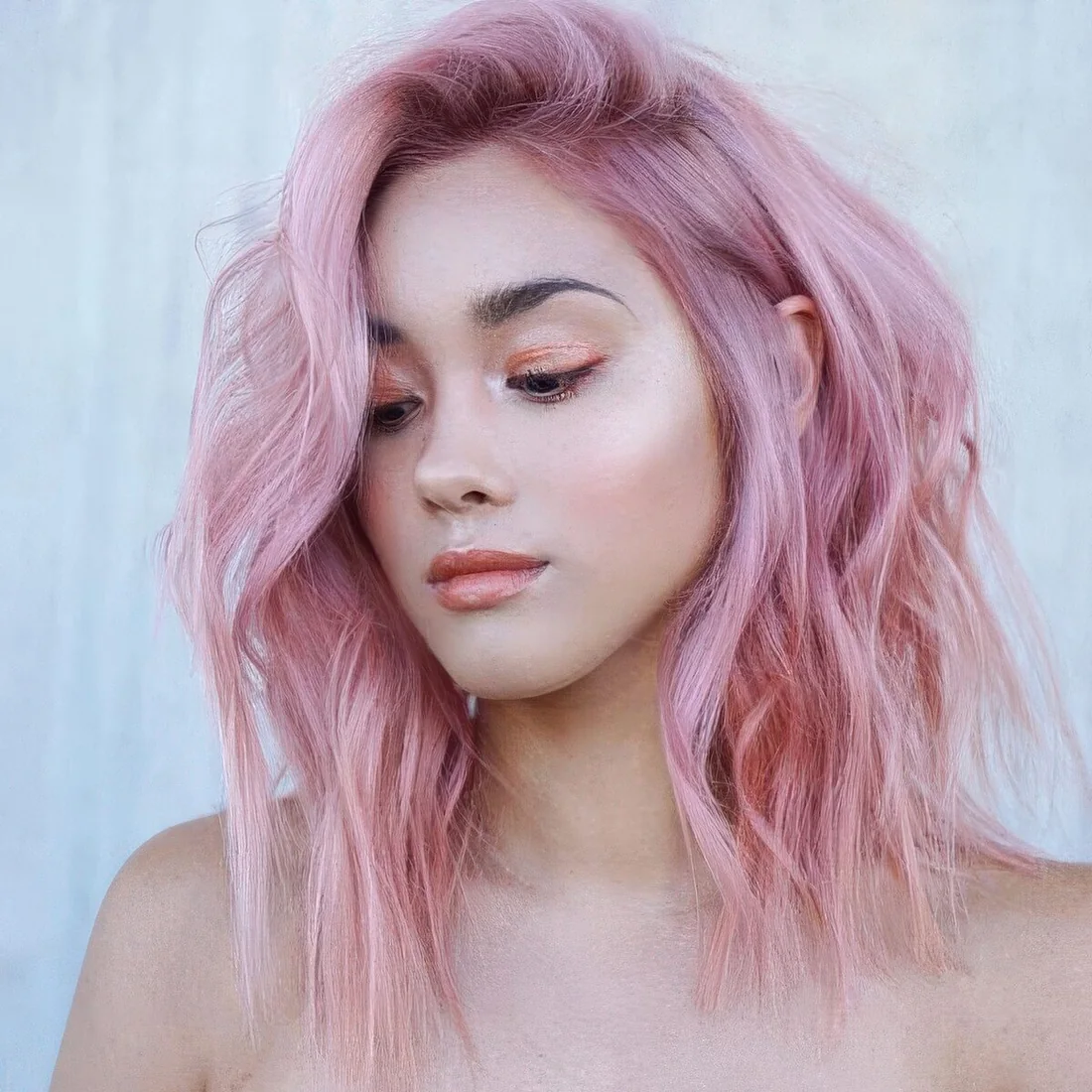 Fab pink shoulder-length hair with much texture and volume.