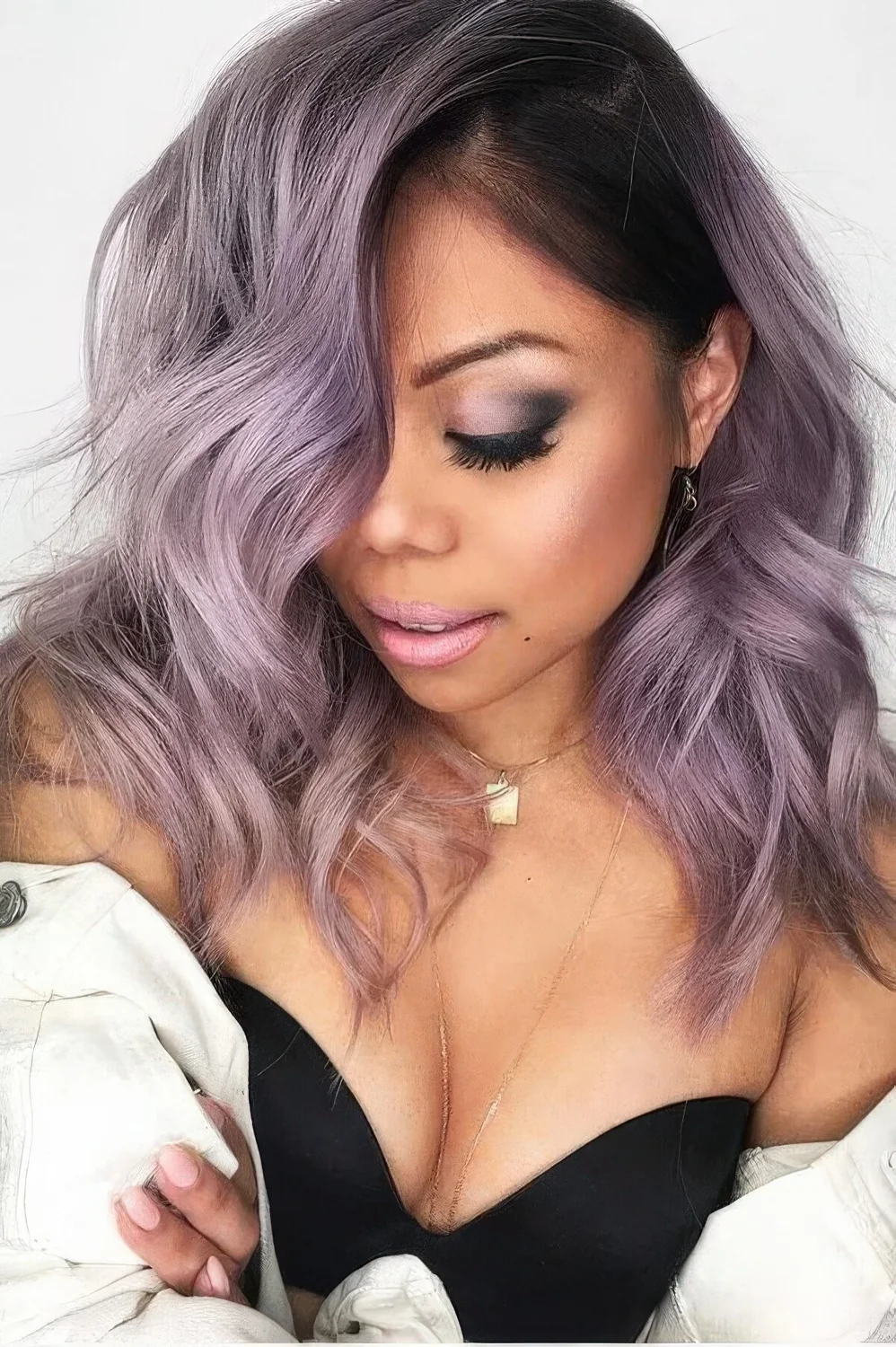 Photo showing lilac hair with a darker root, with the hairstyle clearly visible.