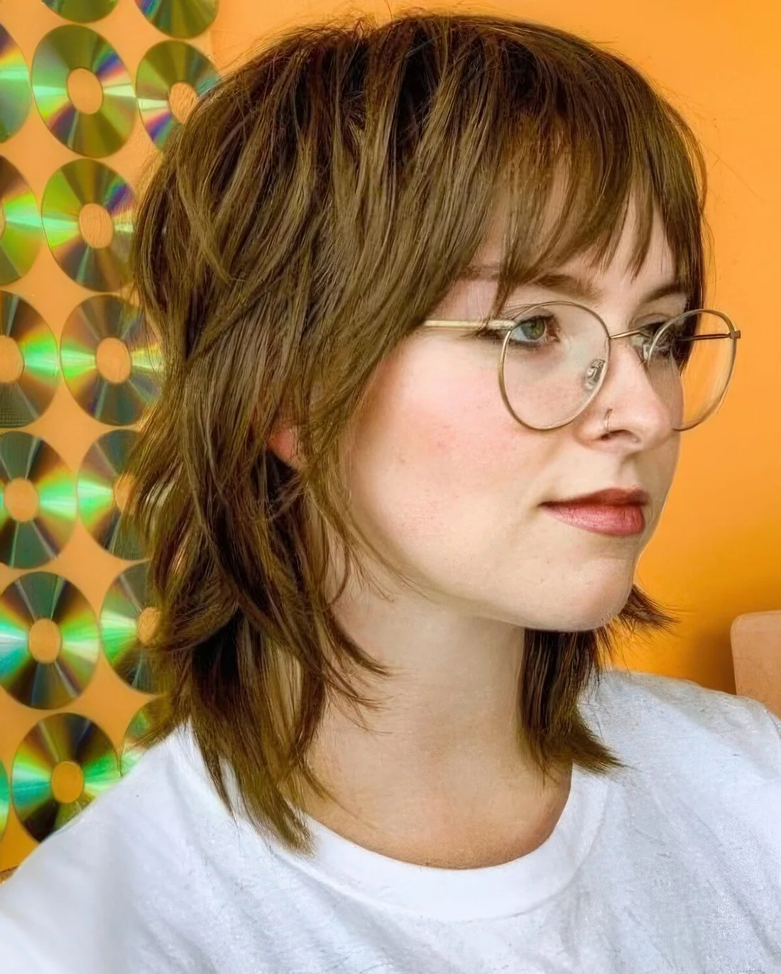Photo showing hairstyle with wispy bangs, with the hairstyle clearly visible.