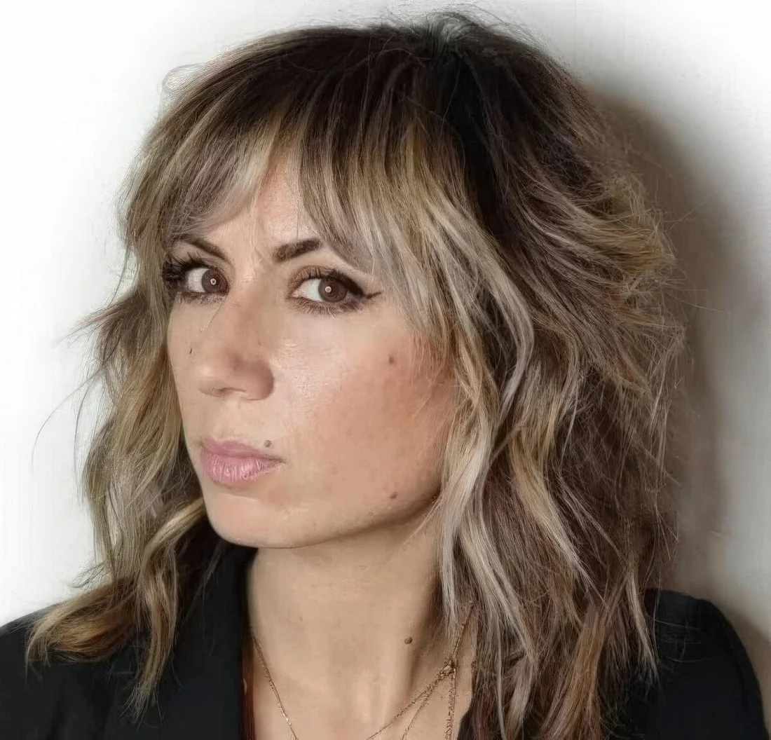 Ashy blonde balayage softens the wolf cut haircut and produces a modern look that.