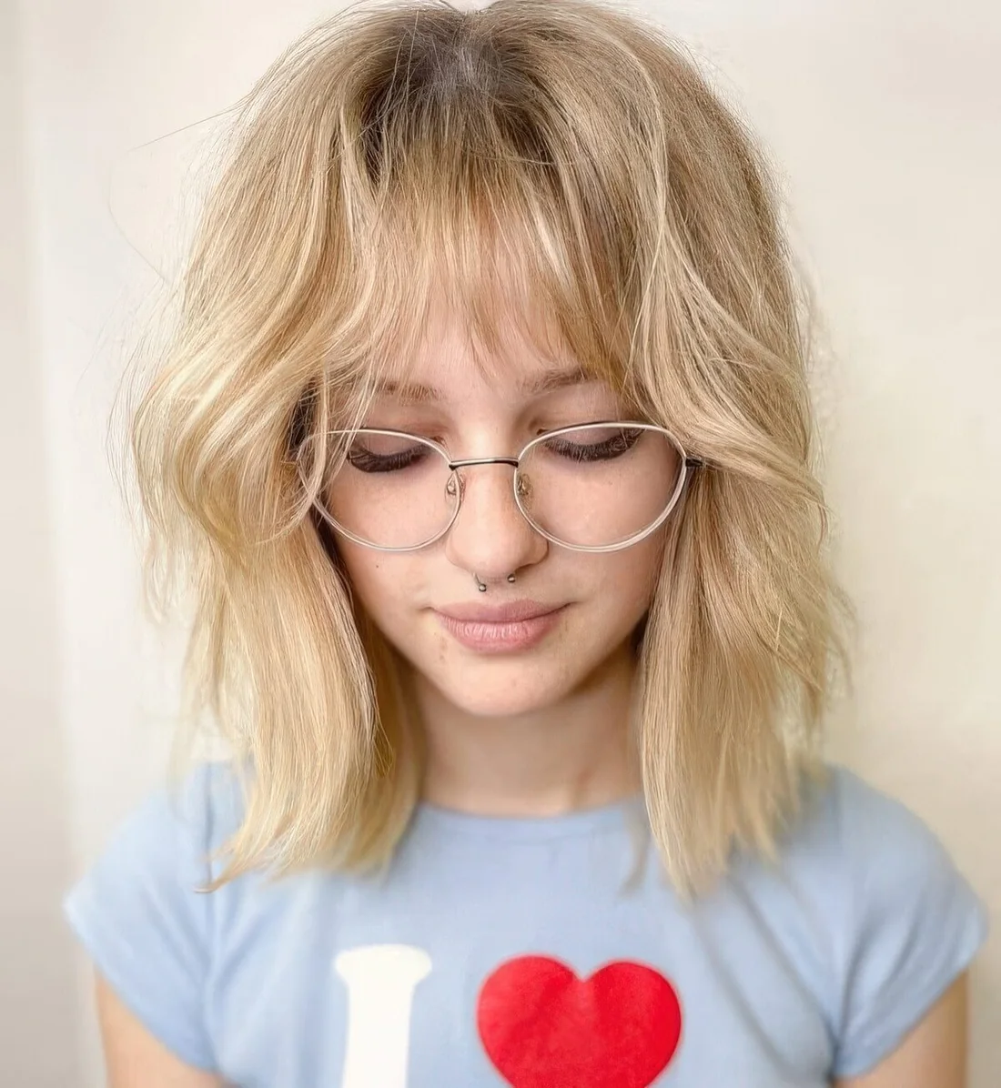 This blonde hairstyle with long bangs.