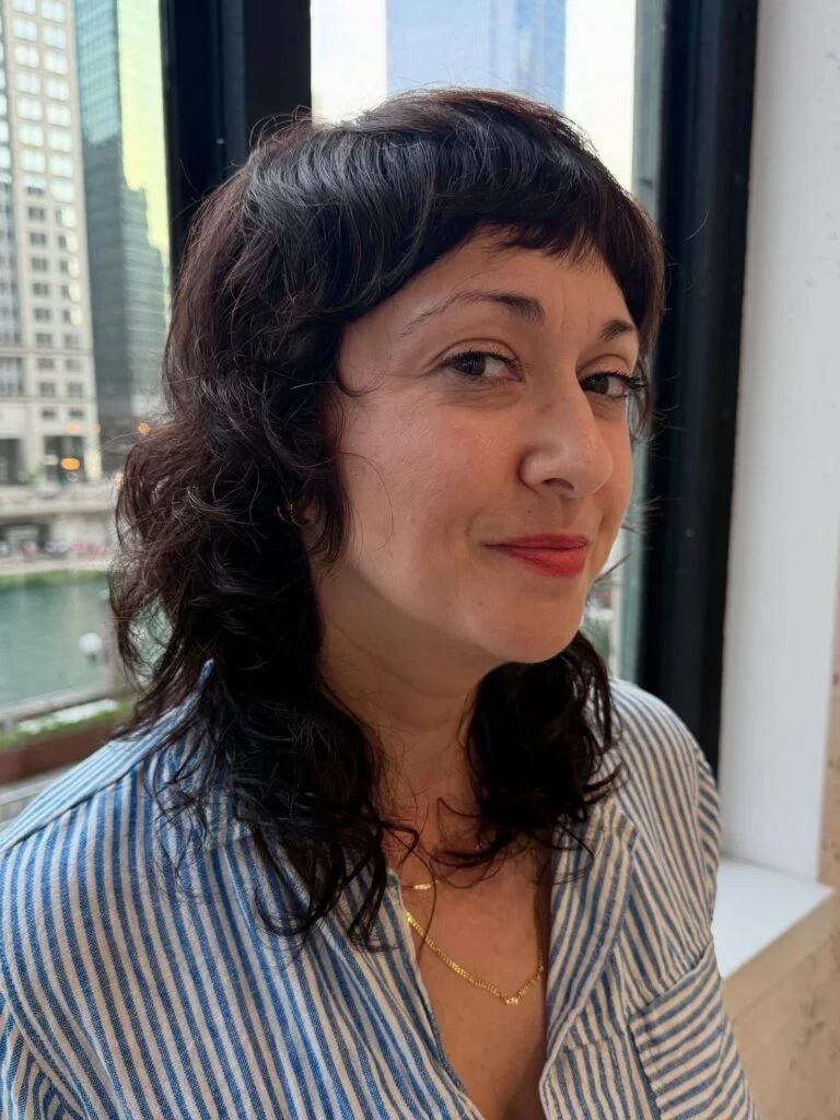 shoulder curly chestnut shag with curly fringe fringe shown as a messy haircuts for women over 60 idea, featuring curly texture