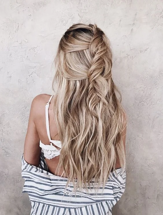Loose half updo with a loose braid to let the air in and out.