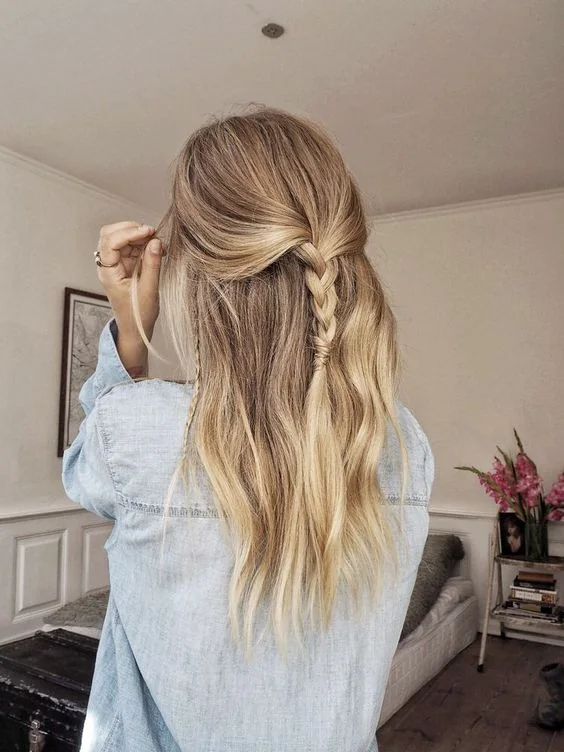 Half updo with loose hair and several simple braids here and there.
