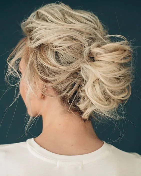 Photo showing very messy and loose updo, with the hairstyle clearly visible.