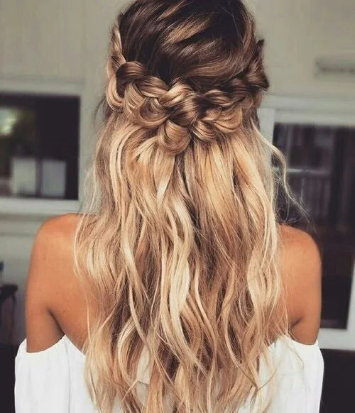Half updo with loose hair and a braid.