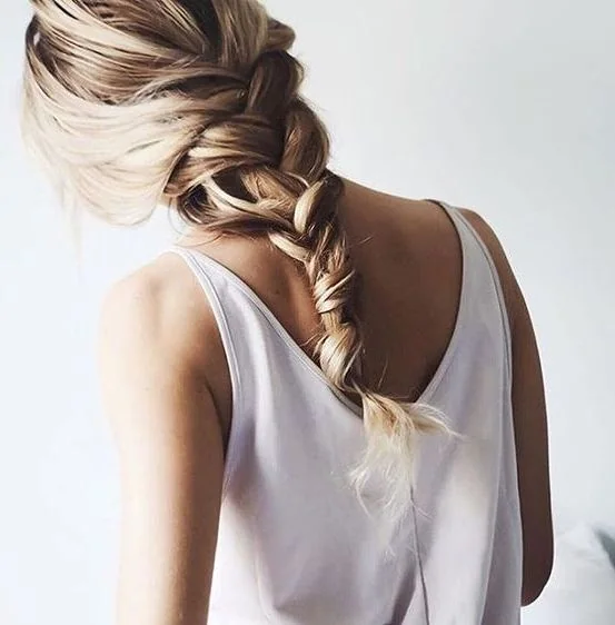 Photo showing simple loose braid, with the hairstyle clearly visible.