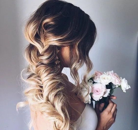 Photo showing very loose fishtail braid, with the hairstyle clearly visible.