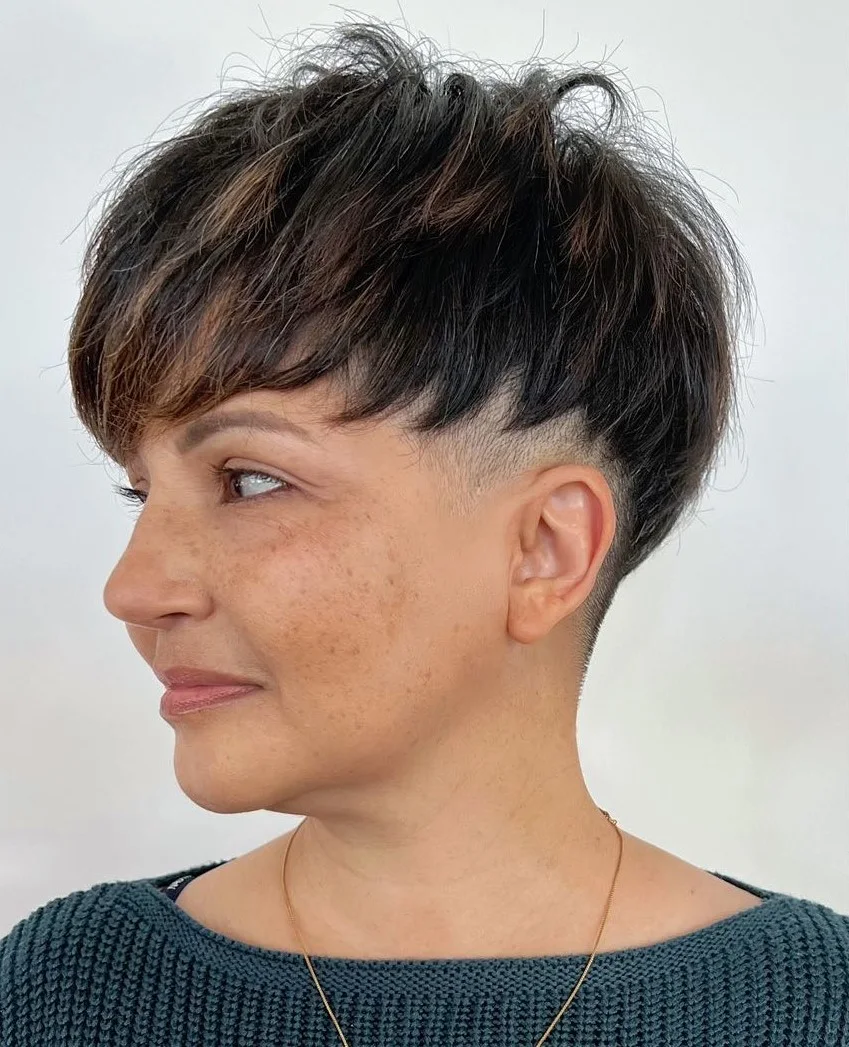 ear straight chestnut undercut shown as a messy pixie cut with bangs idea