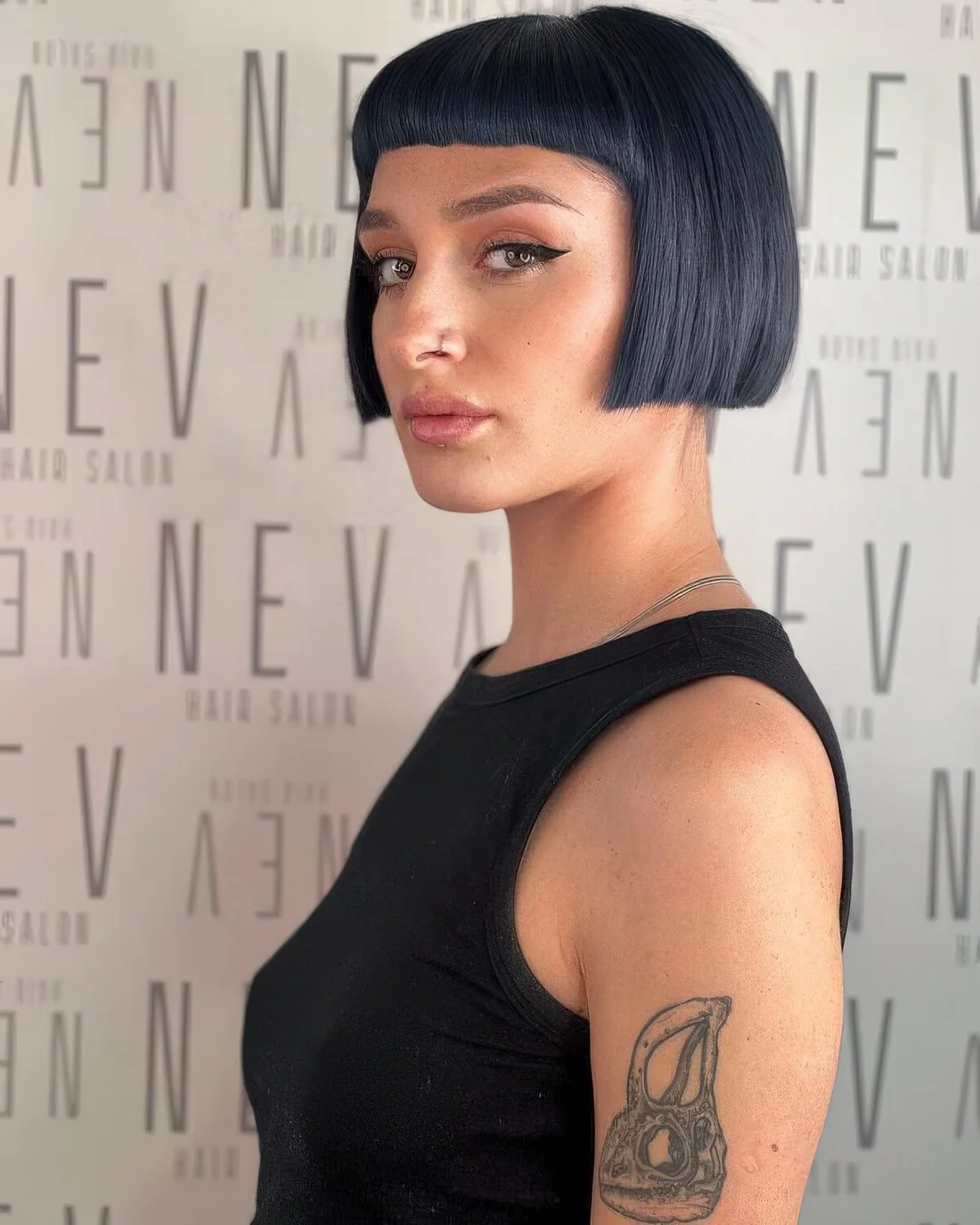 Black micro bob with short baby bangs.