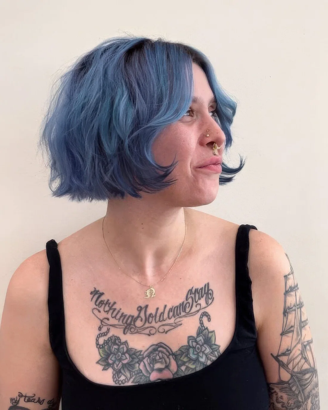 Blue chin-length bob with a darker root and waves.