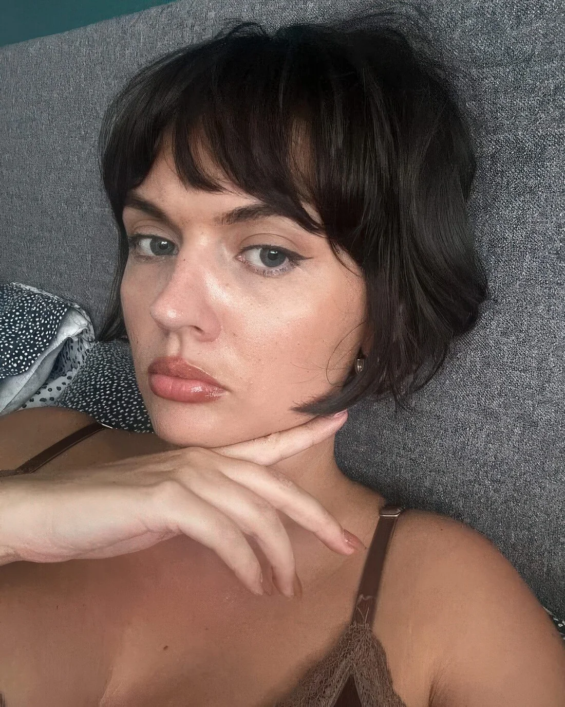 Classic French line length bob in dark brown, with bottleneck bangs and a bit of waves.