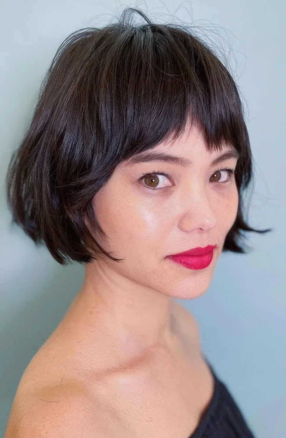 Photo showing short bob with bangs, with the hairstyle clearly visible.