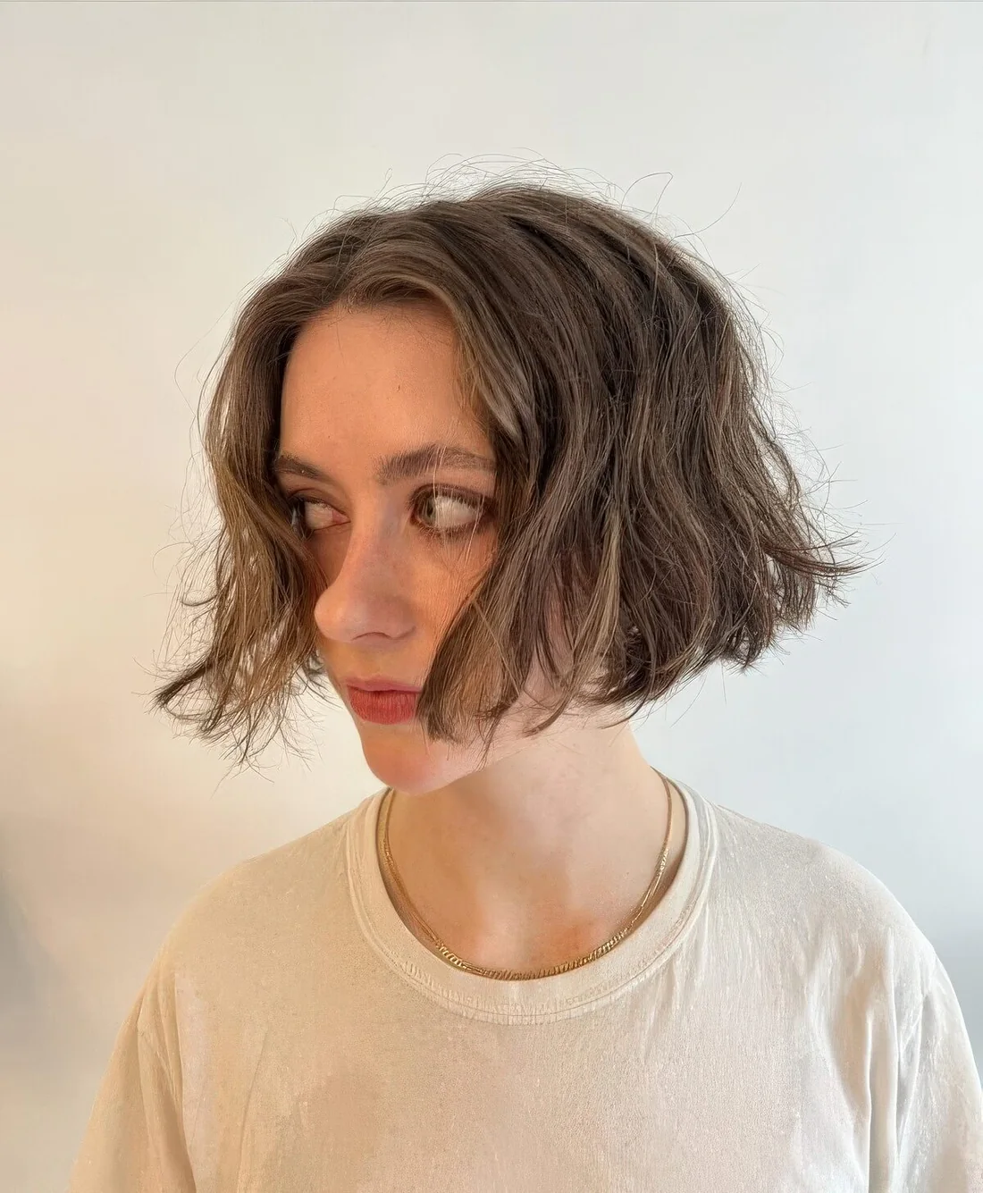 Wavy blunt lip line bob with messy texture.