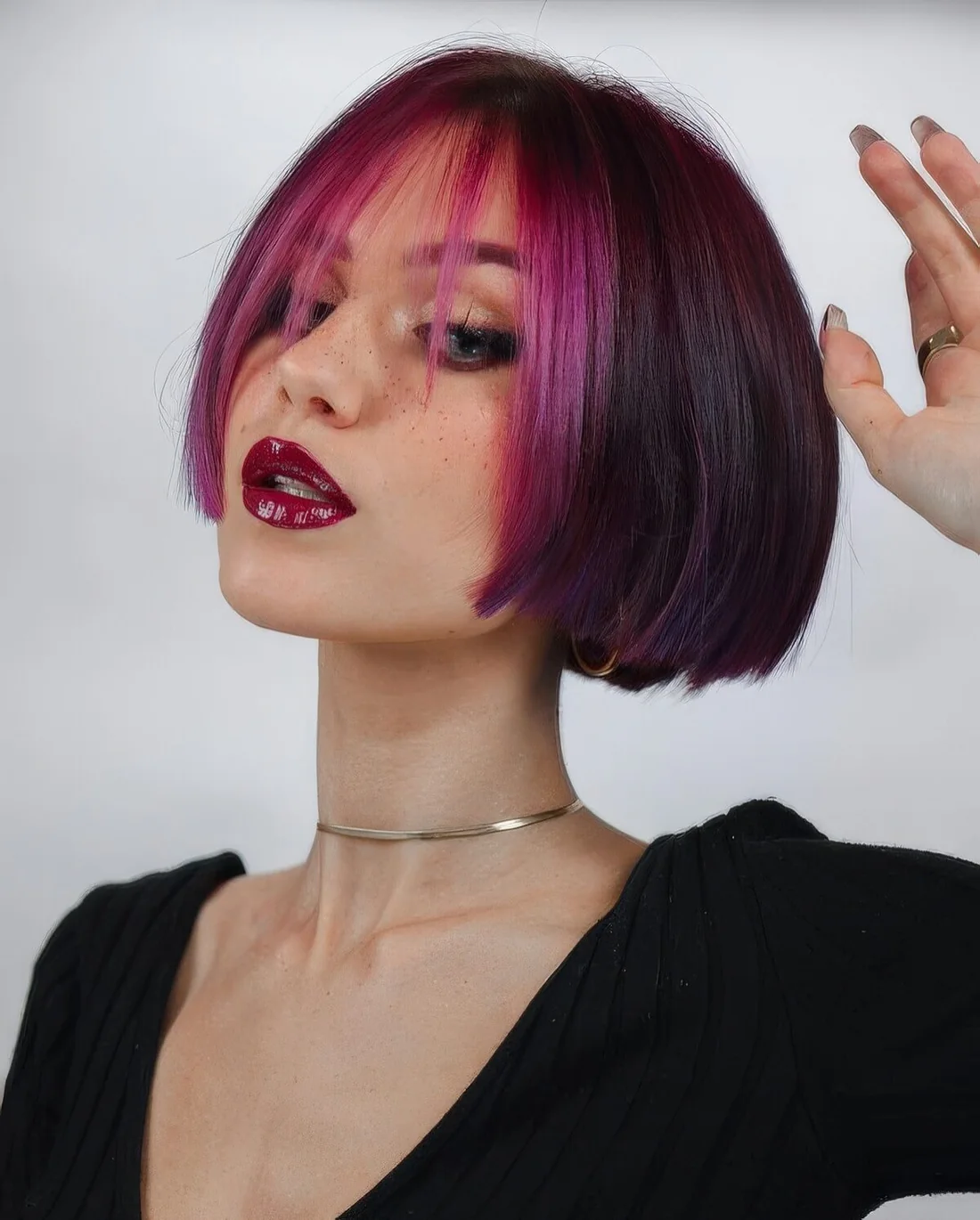 Go bold with a fuchsia and purple jaw-length bob and make a statement with the colors.