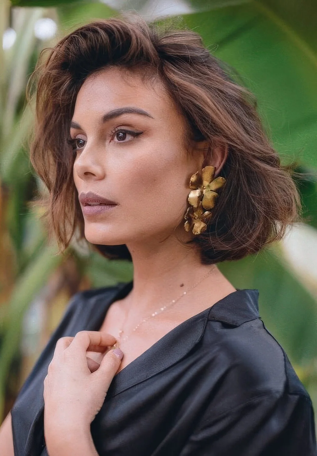 Dark brown, almost black bob with caramel and brown balayage, with messy waves and texture.