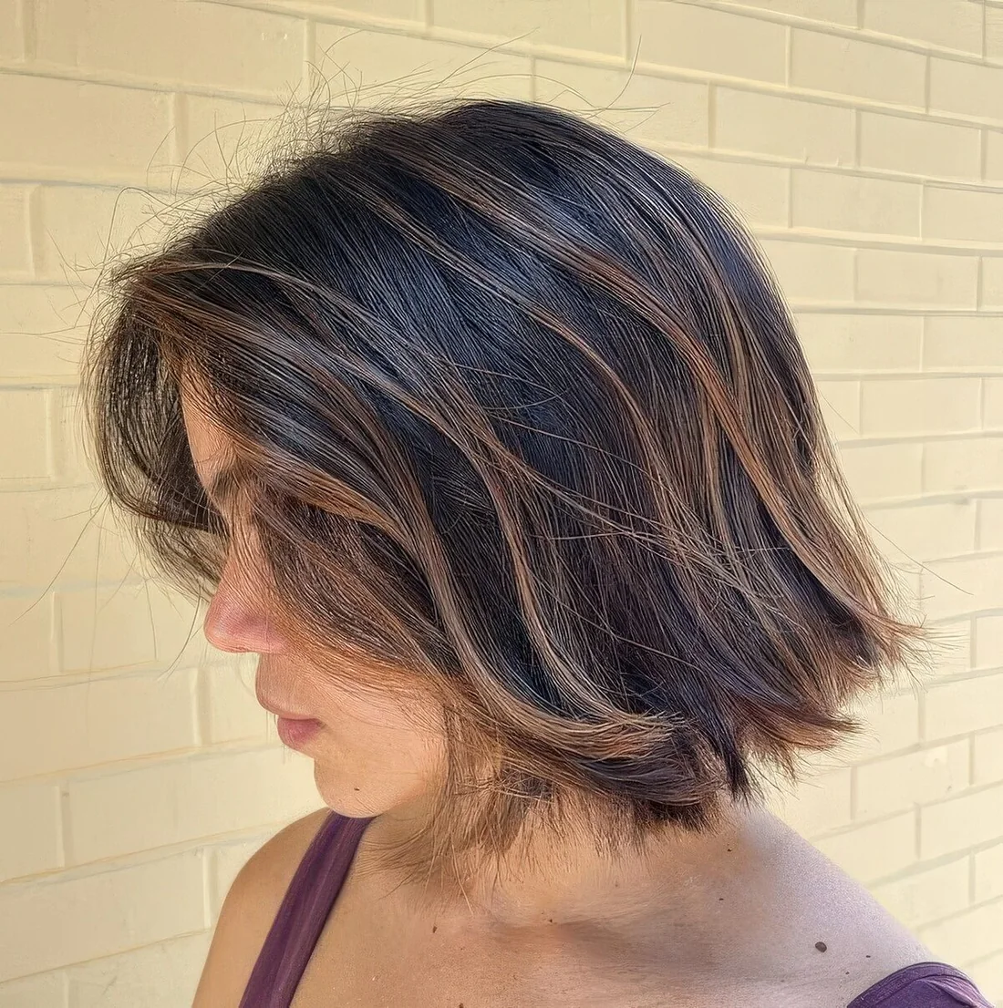 Dark textural bob with caramel balayage and babylights.