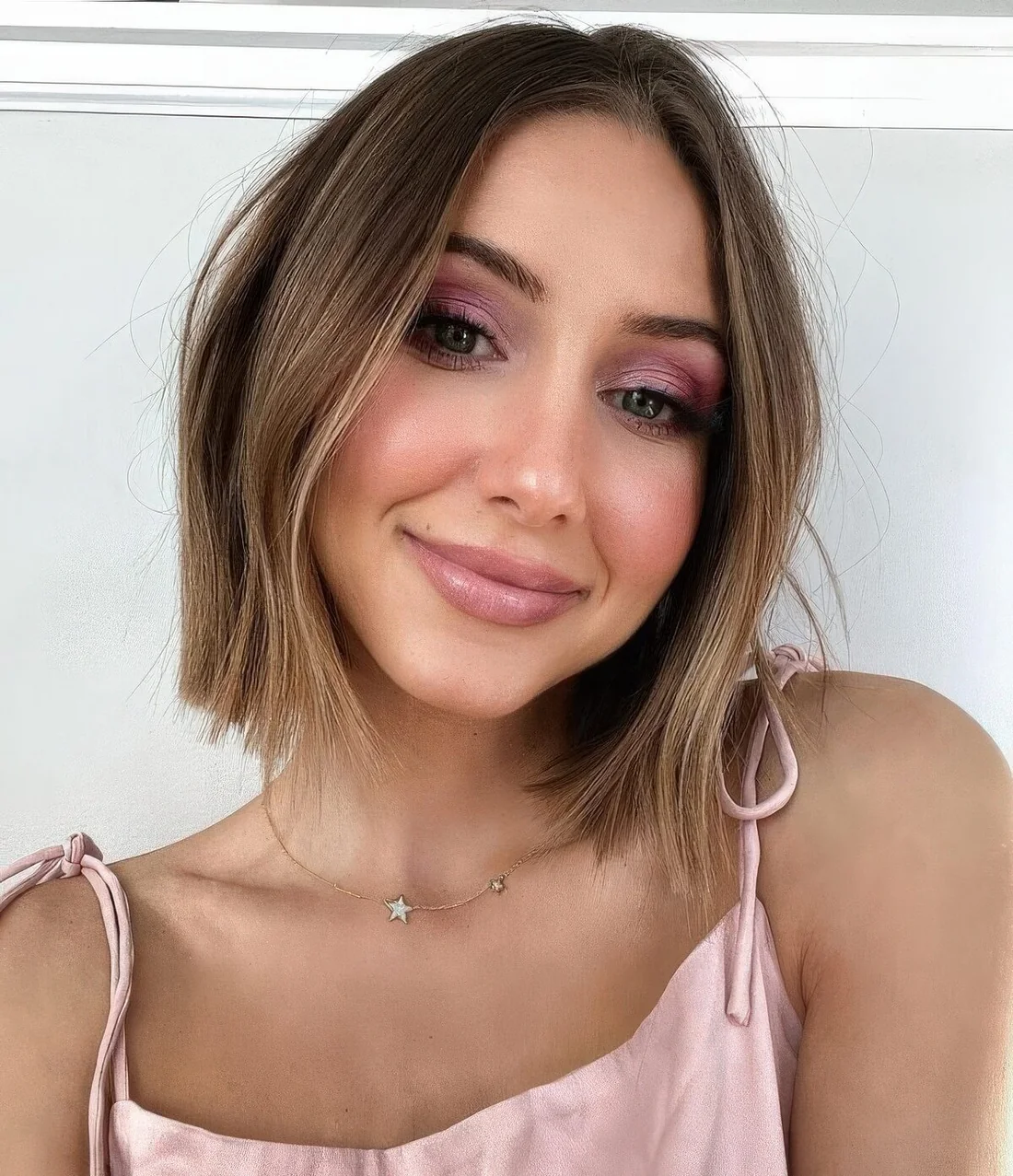 Layered bob with wispy layers to add shape and volume to fine hair, some balayage for a brighter look.