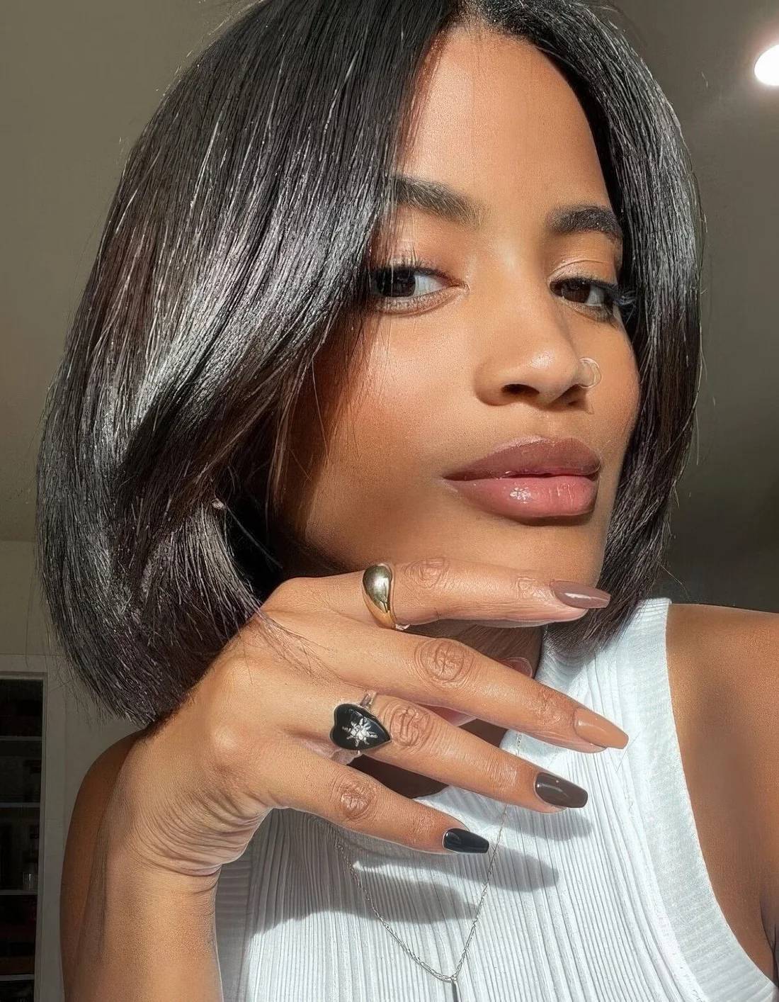 Fab and shiny black liquid bob withcurtain bangs.