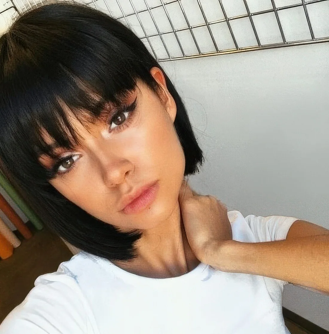 Black boy bob with fringe bangs for a super cute, doll like look.