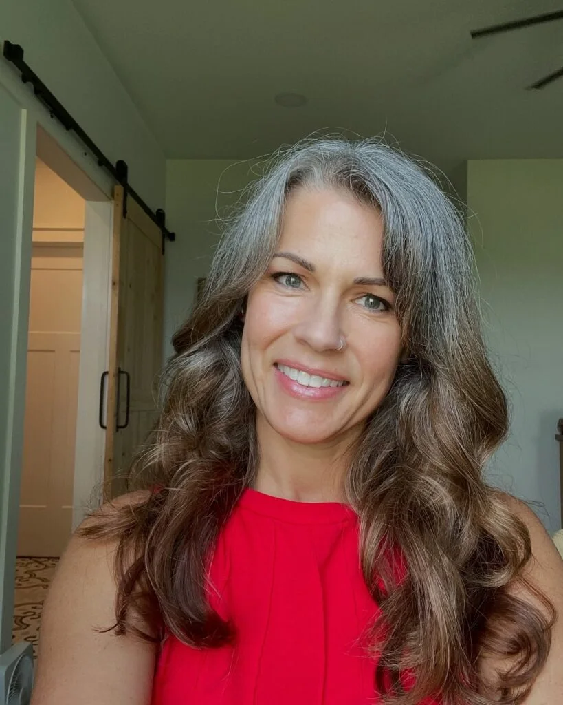 chest wavy silver layers shown as a mother of the bride hairstyles idea