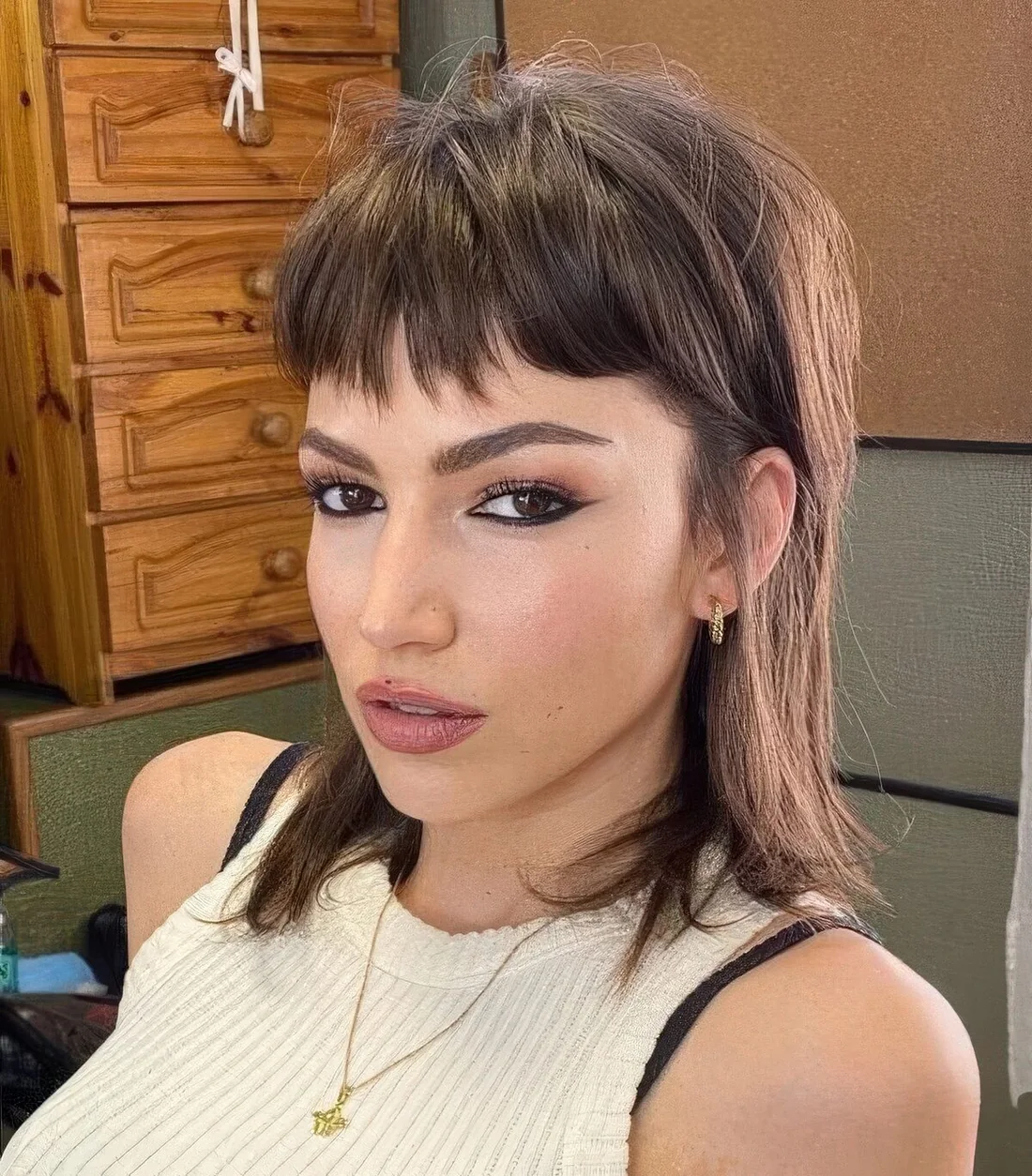 Brown mullet with fringe and a texture.