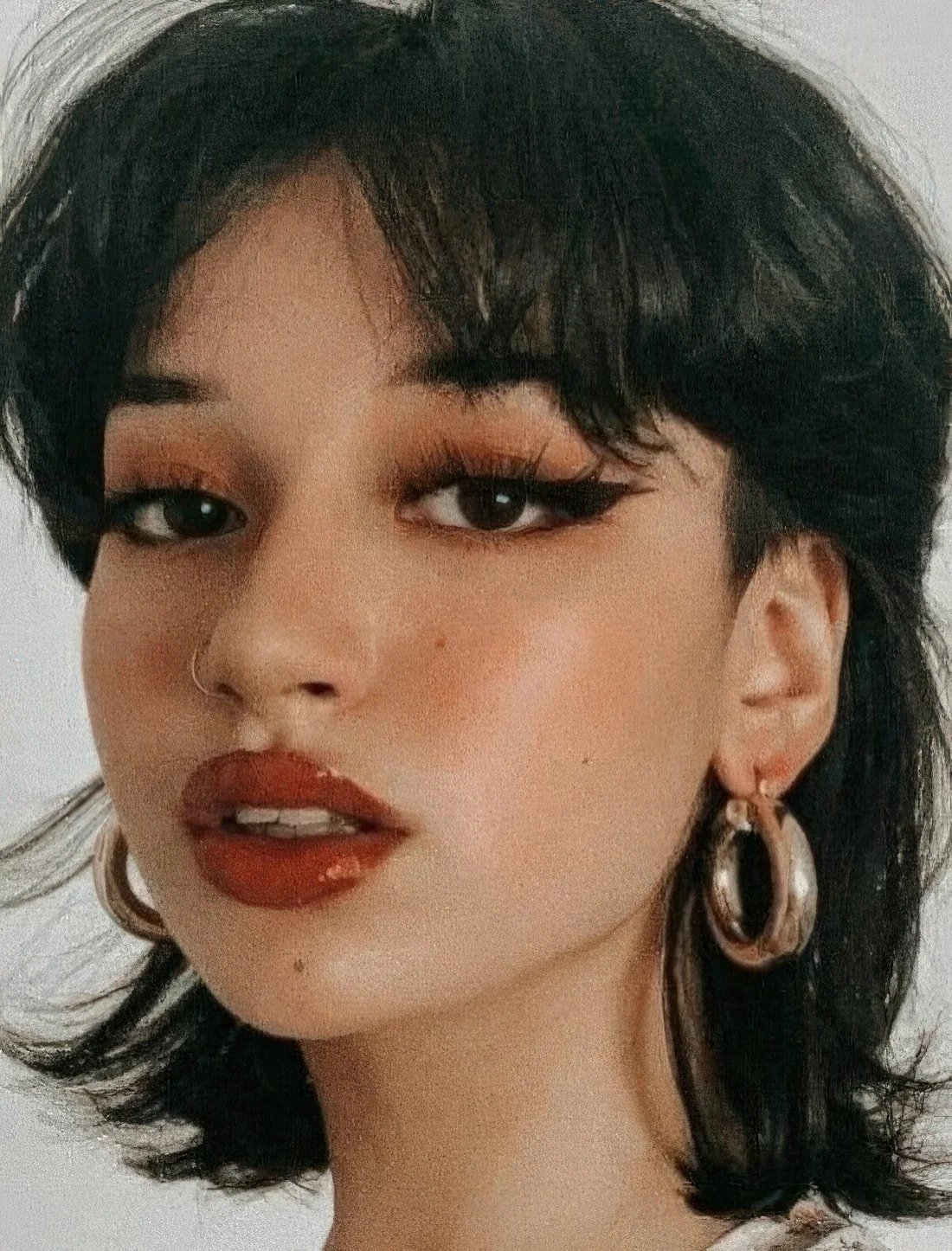 Photo showing mullet hairstyle with bangs, with the hairstyle clearly visible.