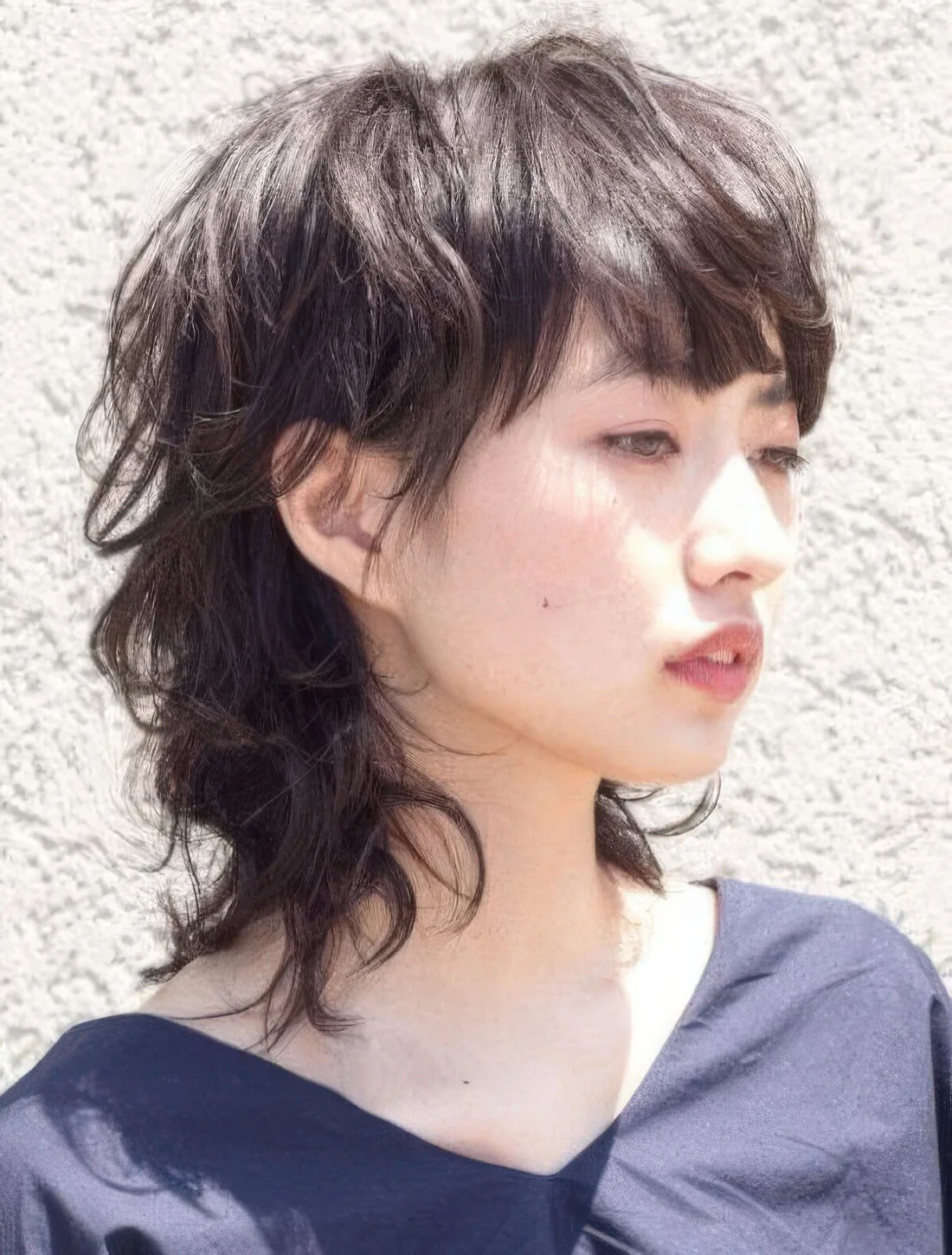 Wolf cut hairstyle combines the mullet and the shag, giving you a wonderful, heavily layered finish.