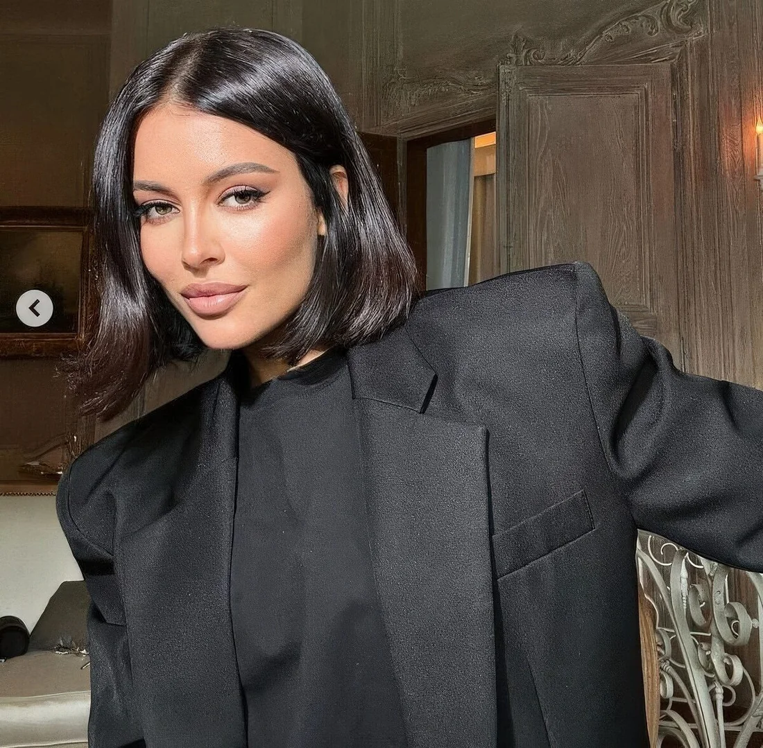 Photo showing shiny black bob, with the hairstyle clearly visible.