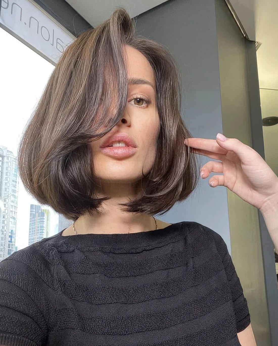Photo showing brown bob curled ends, with the hairstyle clearly visible.