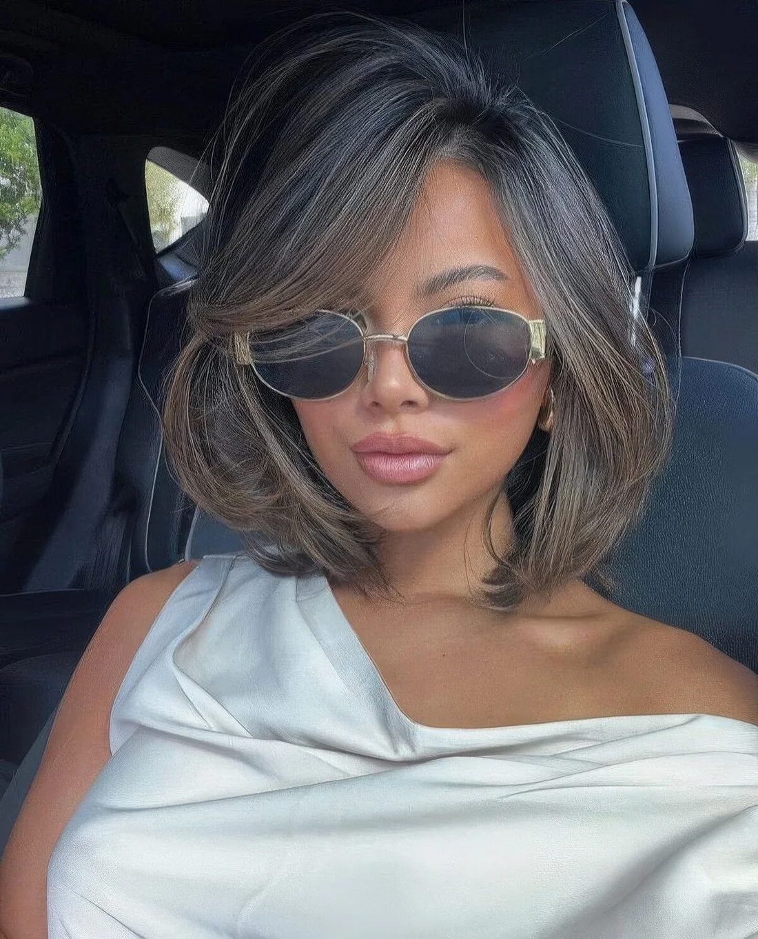 Photo showing brown butterfly bob highlights, with the hairstyle clearly visible.