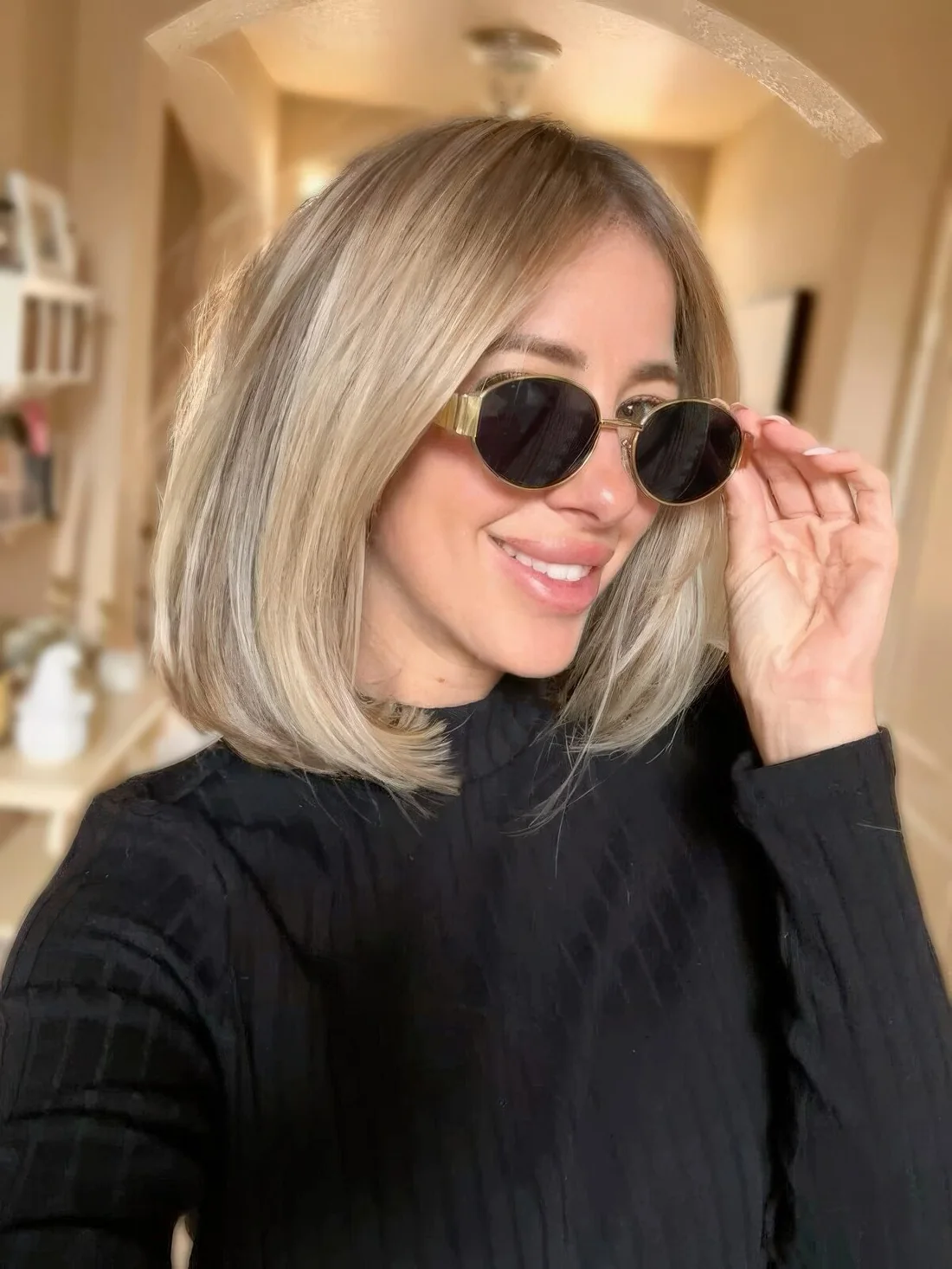 Photo showing long blonde bob, with the hairstyle clearly visible.