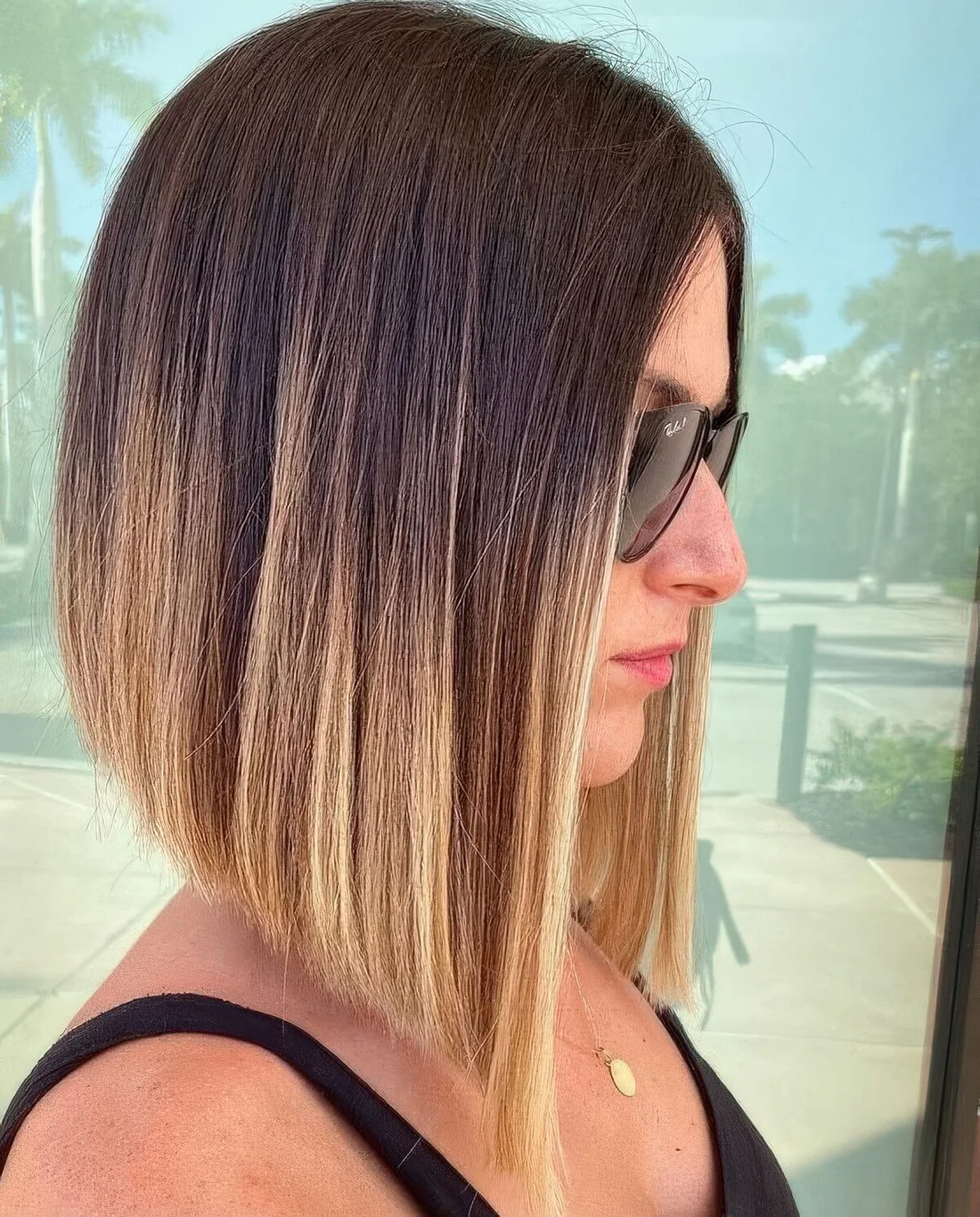 Long angled bob with a darker root and an ombre effect to blonde on the ends.