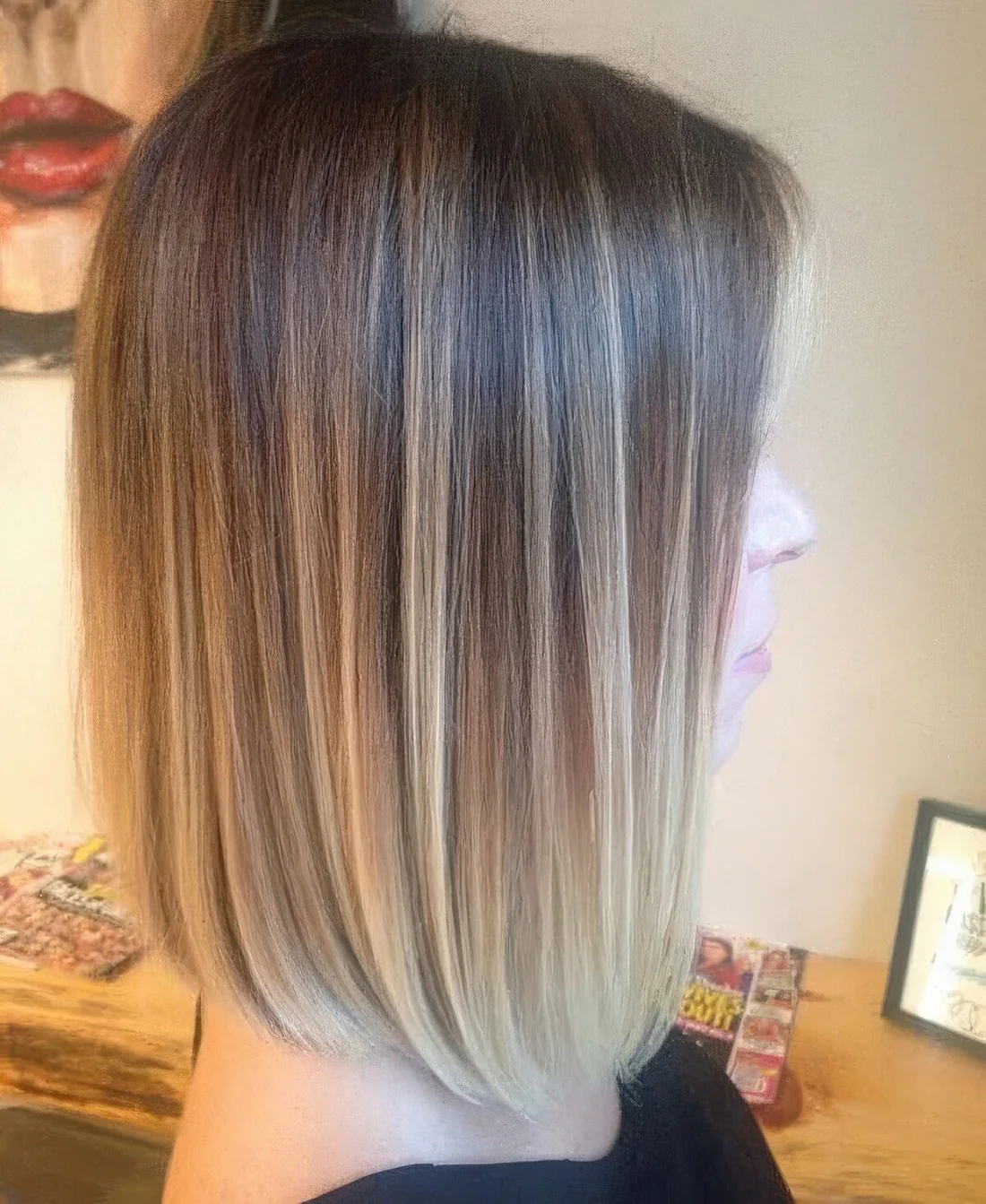 Long ombre bob from light brunette to bleached blonde, with a lot of volume.