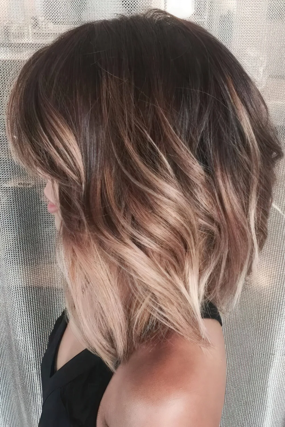 Dark brown and plum hair with bronde ombre for a dimensional look.