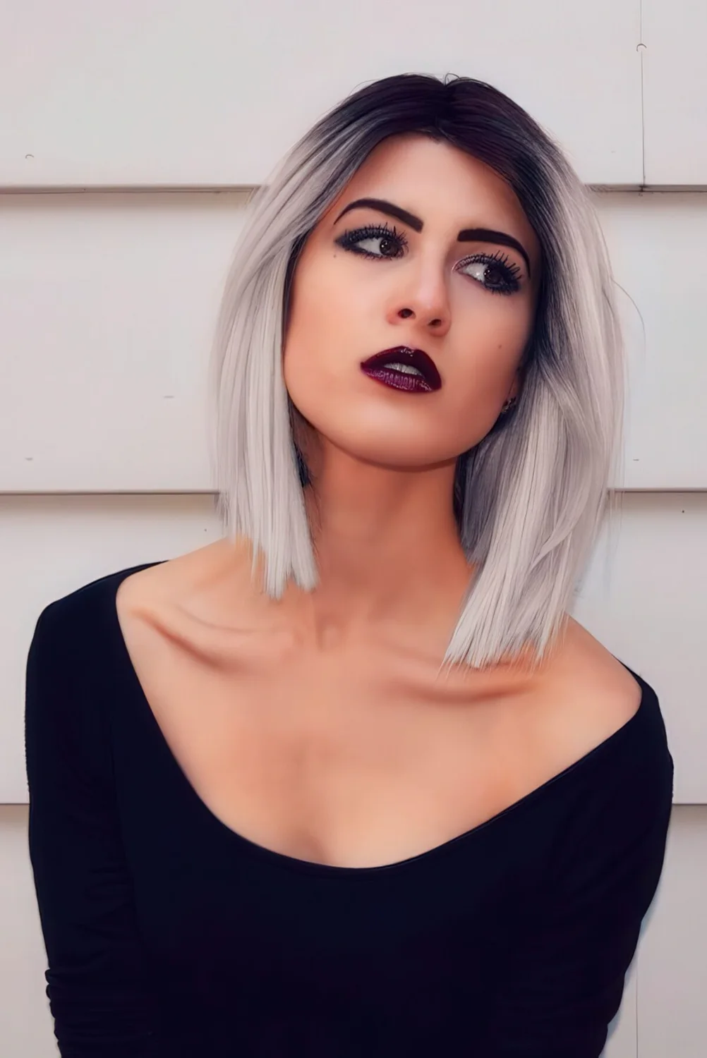 Black roots with silver grey ombre hair.