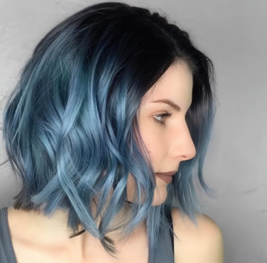 Black roots and metallic blue ombre with waves.