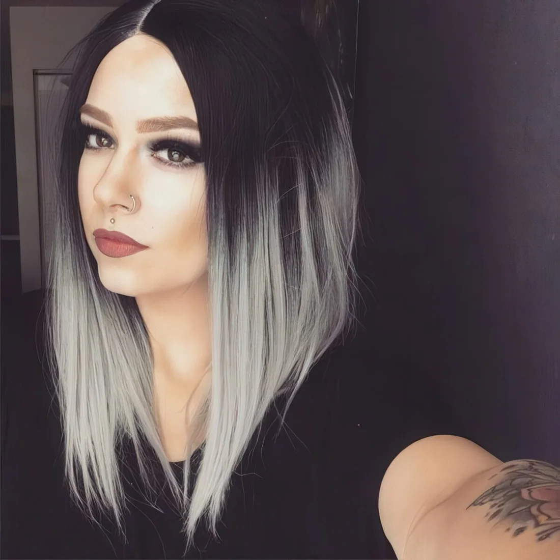 Black hair with ashy grey ombre on an assymmetrical bob haircut.