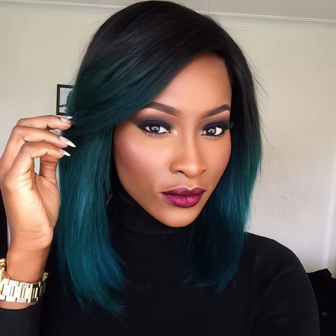 Black roots with teal ombre for a very contrasting look.