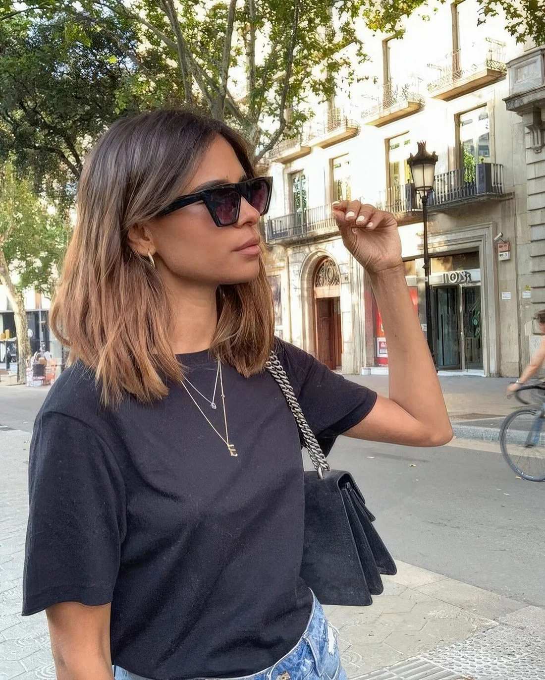 Dark brown outgrown bob with caramel ombre and texture, with center part.