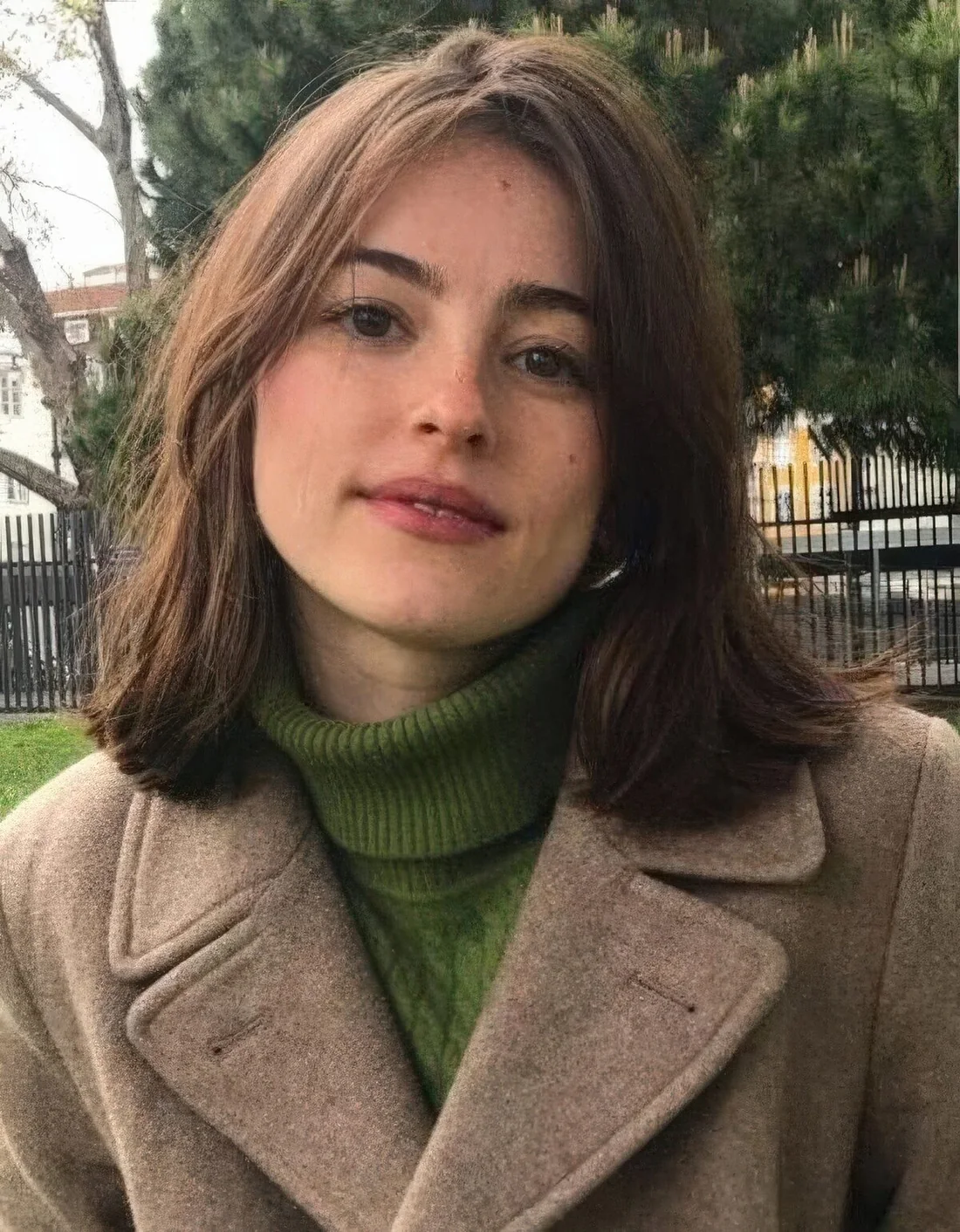 Brown outgrown bob with side bangs and middle part.